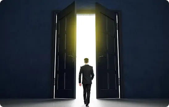Businessman entering open door