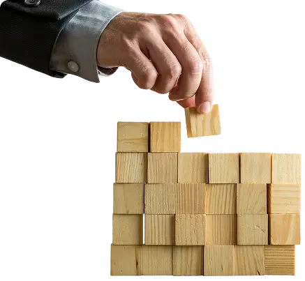 Businessman stacking wooden boxes