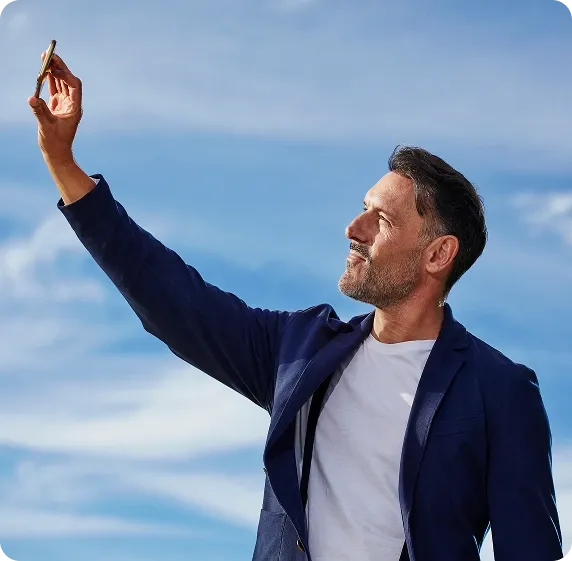 Man taking a selfie on the beach